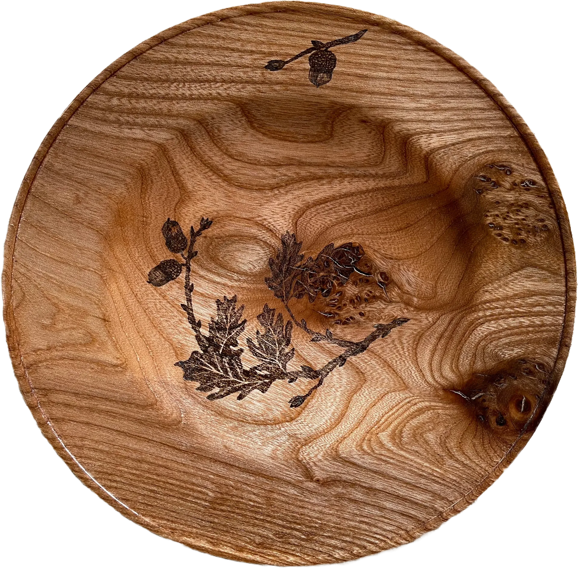 a large bowl with oak branches and acorns drawn in the centre and rim using pyrography