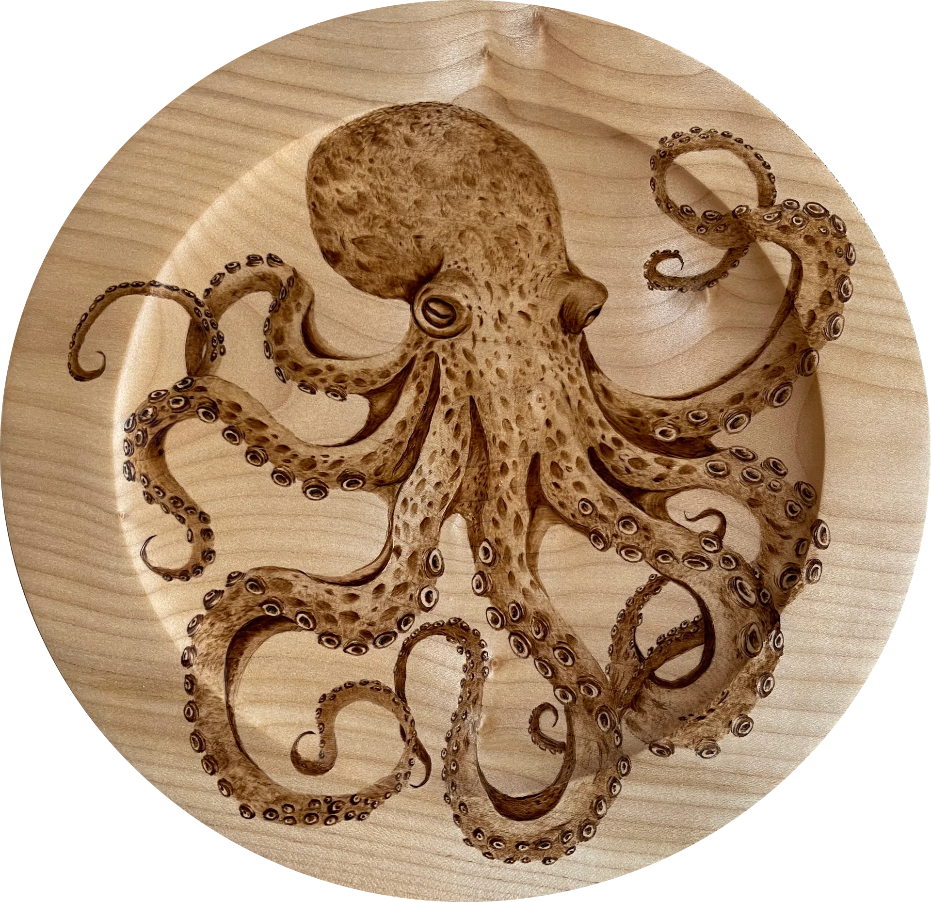 A mediums sized bowl with an octopus in the centre using pyrography