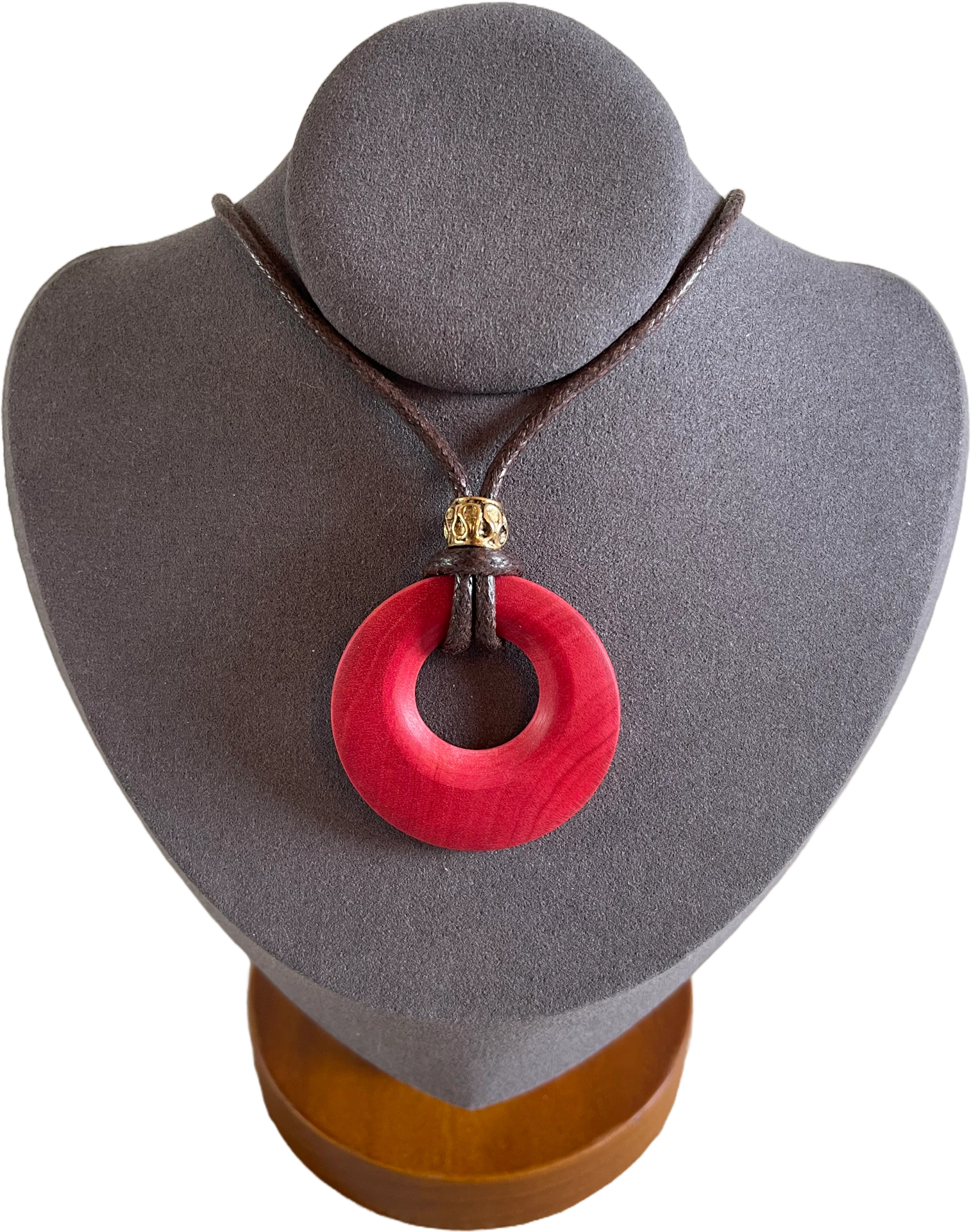 A pink wooden necklace made out of a wood from Zulu royalty